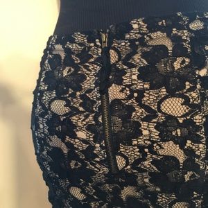 XXI Sexy Fitted Black lace skirt with back zipper.